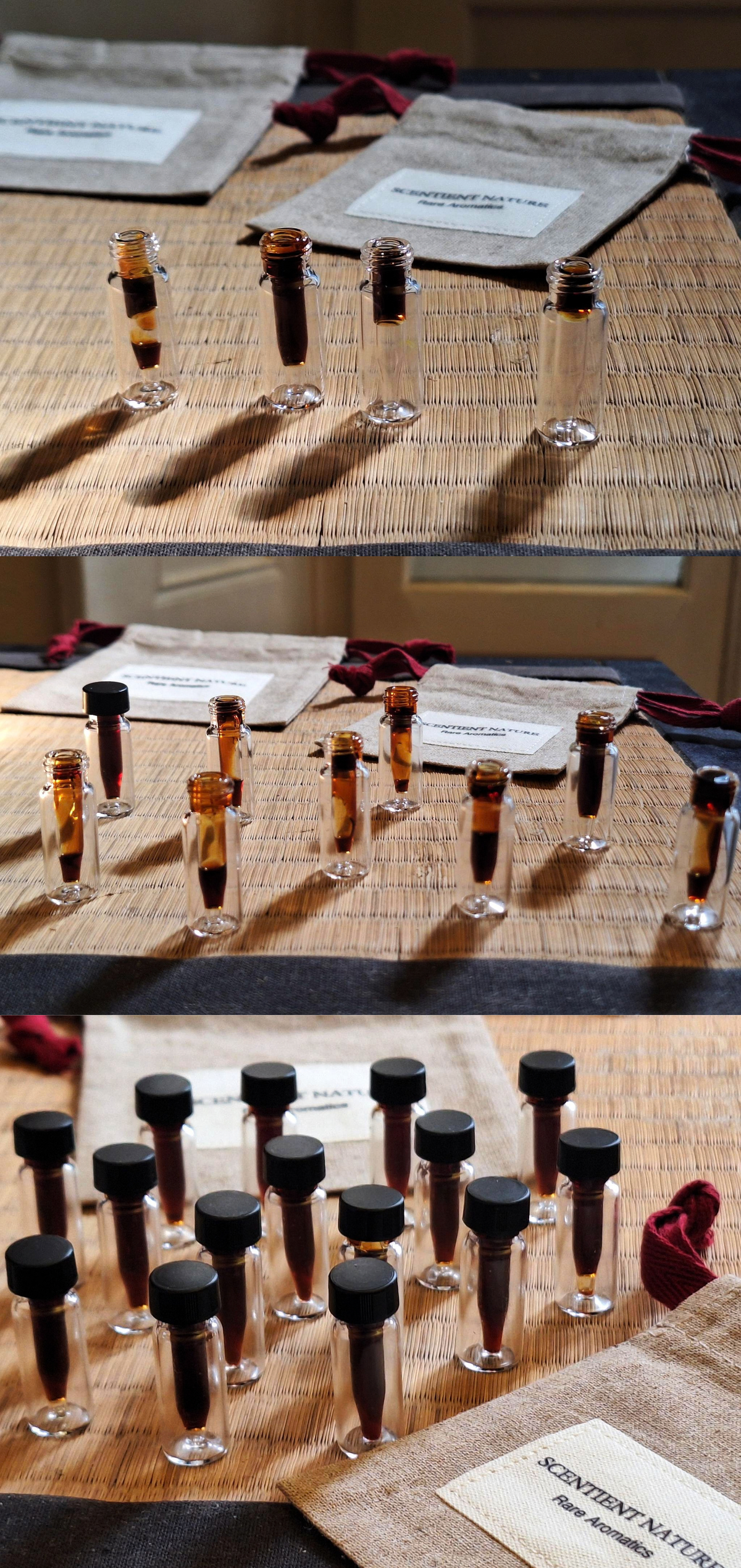 Three stacked photos showing small clear glass lab vials with a viscous dark liquid and black caps arranged on a woven mat and tabletop, with fabric labels and a card reading 'SCENTIENT NATURE' visible. The stacked photos disclose different stages of the complex and demanding decanting process of this 50 year old patchouli oil.